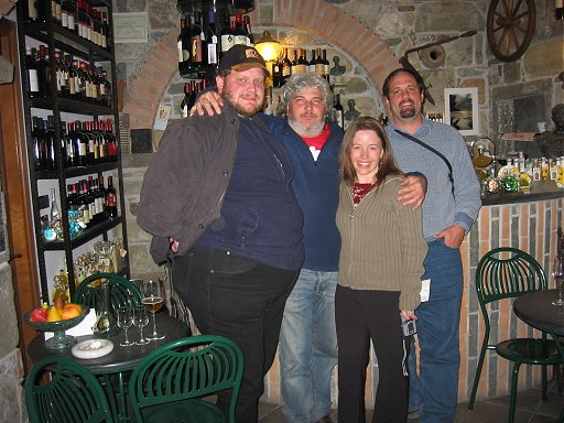 Speedy, Mario the owner, Kelli and Adrian the author in the Enoteca Pirun